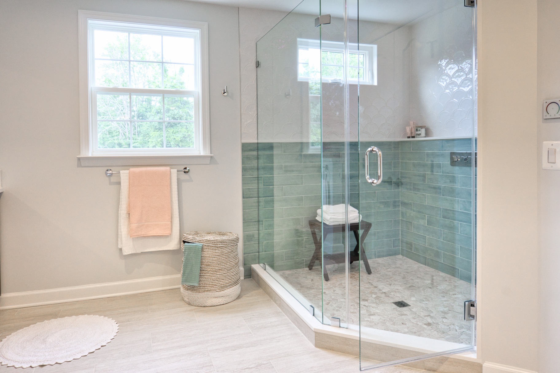 Modern fitted bathroom with glass shower enclosure